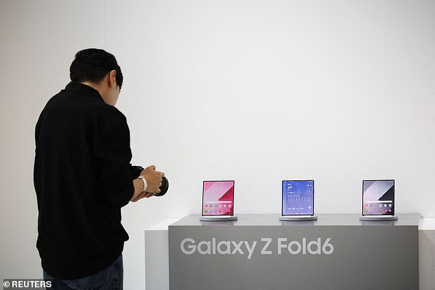 Above, a photographer takes glamour shots of Samsung's latest Galaxy Z Fold