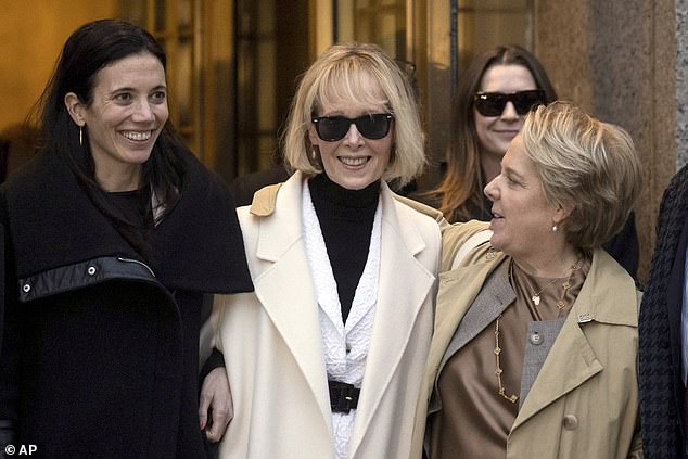 E. Jean Carroll (center) leaves federal court in New York City on January 26, 2024 after a jury awarded her $83.3 million in a case against former President Donald Trump