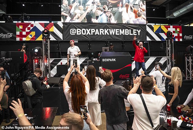 The 58-year-old actor, known for his role as Barry Evans in the BBC soap, delighted English football fans by singing YMCA and Sweet Caroline at the event