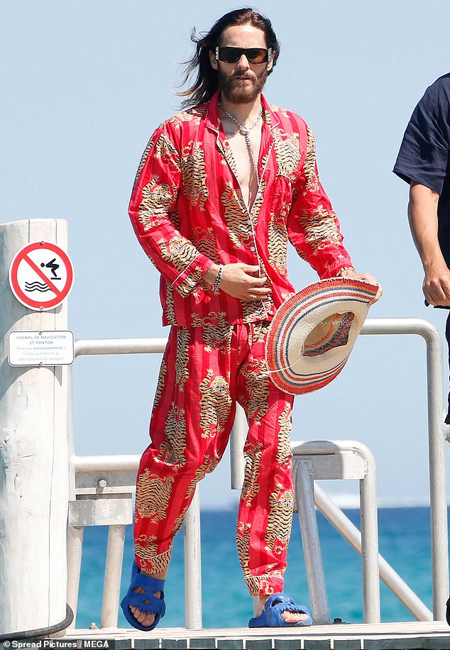 Jared completed his look with black sunglasses and blue sandals and he wore a colorful wide-brimmed hat