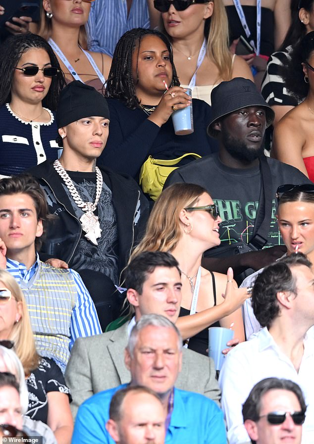 Later he went to watch the tennis, where he was seen in the stands next to Mabel and rapper Central Cee