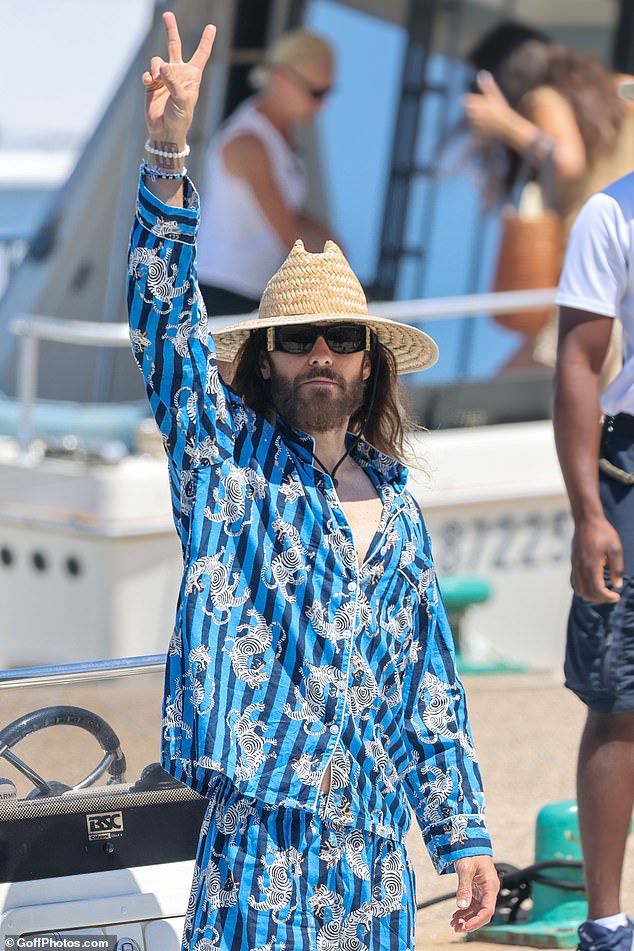 The 52-year-old actor and musician unbuttoned the shirt of his bizarre outfit down to his navel and paired his outfit with bright blue sandals as he headed out for a stroll in the French Riviera town