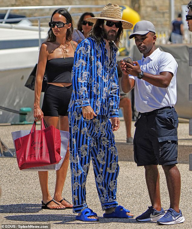 Jared completed his look with black sunglasses and a crazy wide-brimmed straw sun hat as he boarded a yacht with his friends