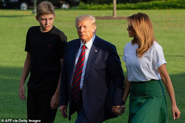 Despite towering at 6-foot-1, 205 pounds, his 6-foot-3 father is a modest figure who rarely speaks and smiles shyly as he moves among the blacked-out SUVs and family apartments in New York's Trump Tower, always with his mother at his side, of course.