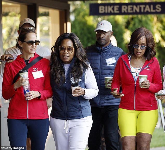 Best friends Oprah Winfrey and Gayle King were also seen at the billionaires' conference, walking alongside Van Jones and Jackie Hindawi (left)