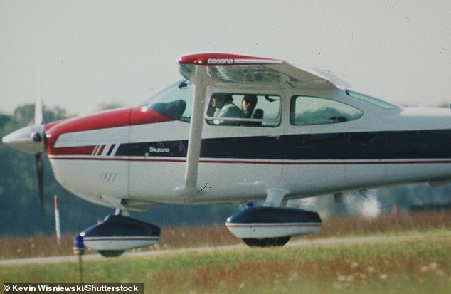 John F Kennedy Jr. sitting in the cockpit with his wife Carolyn in 1998 (he is pictured in an airplane the same year)