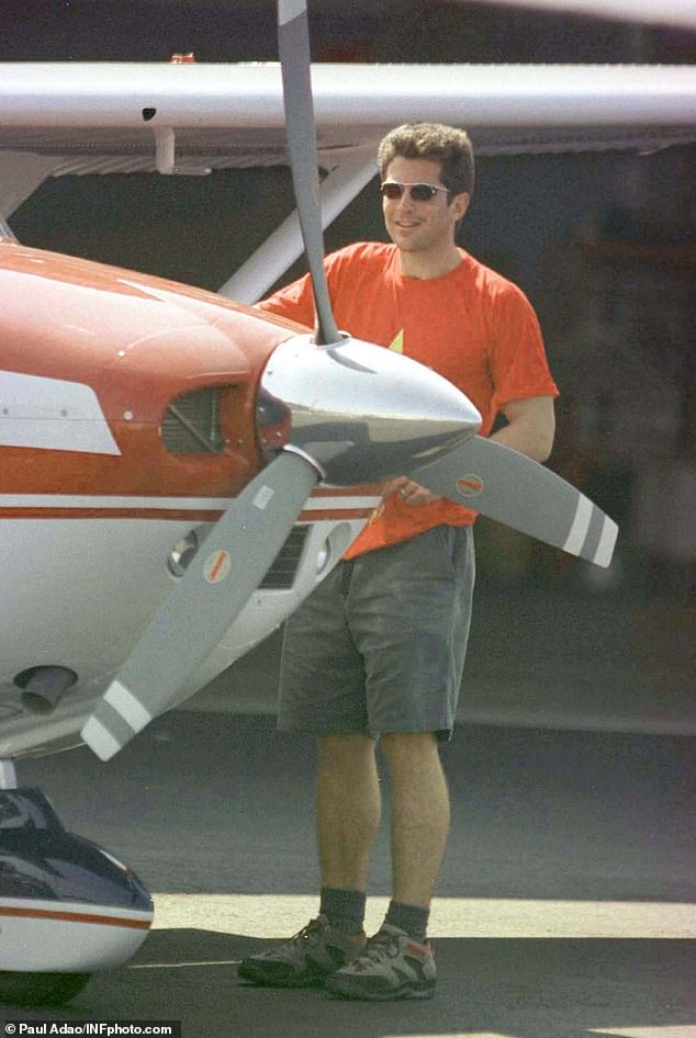 JFK Jr. checks his plane at Caldwell Airport in New Jersey in October 1998