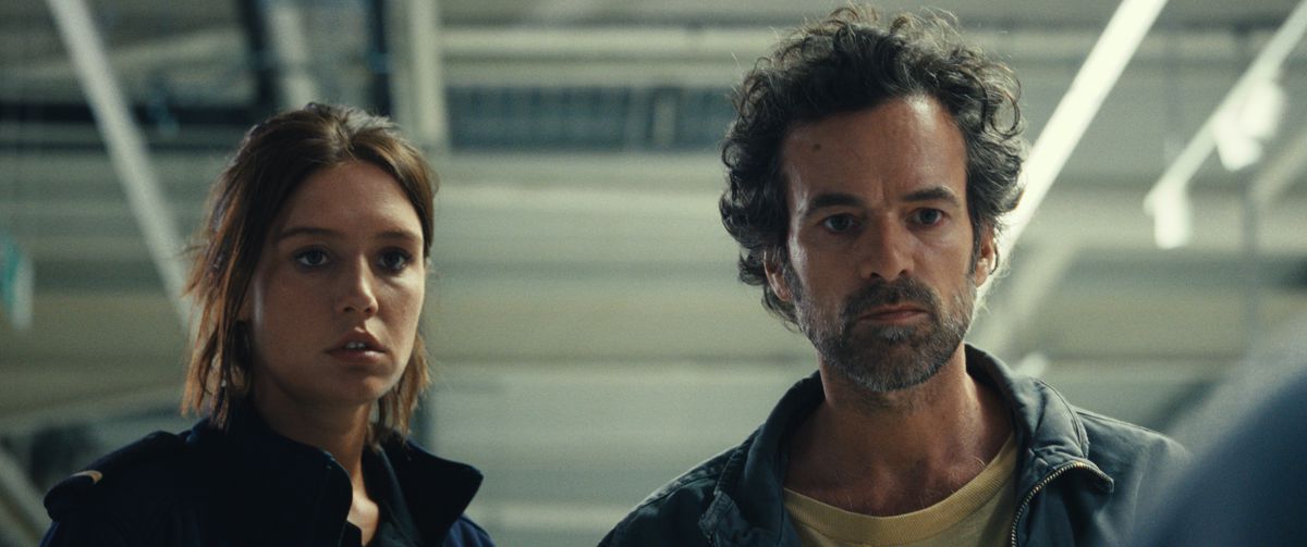 Adèle Exarchopoulos and Romain Duris look bewildered as they stand in a supermarket in The Animal Kingdom