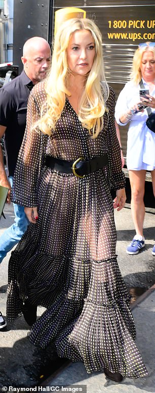 The 45-year-old Oscar nominee opted for a flowy maxi dress in black and white polka dots, fastened with a large black belt and brown boots