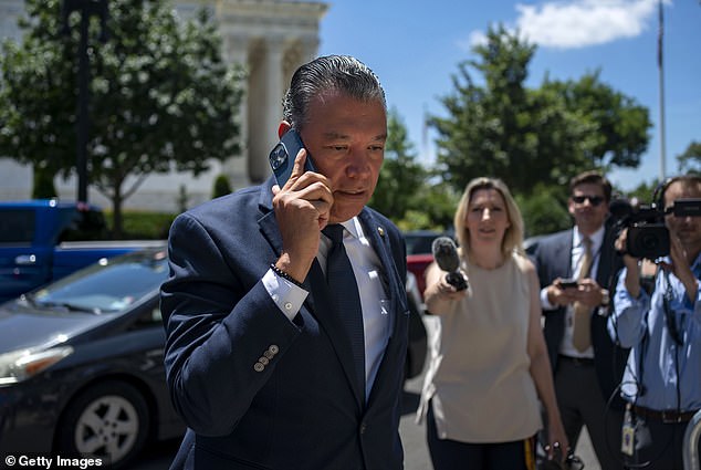 Sen. Alex Padilla, D-Calif., rushed in and dodged questions by answering a phone call