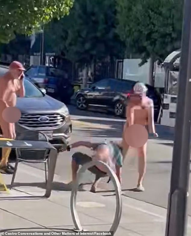 Two nudists, Pete Sferra of San Jose, left, walked in the city's Castro neighborhood with his friend Lloyd Fishback, right, who lives in the city