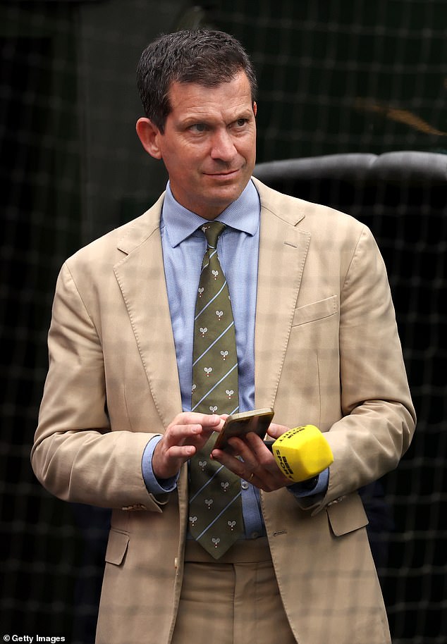 Tim Henman looks on from Centre Court during day eight of Wimbledon