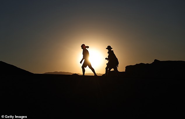 People brave the heat before sunset in Death Valley National Park, California