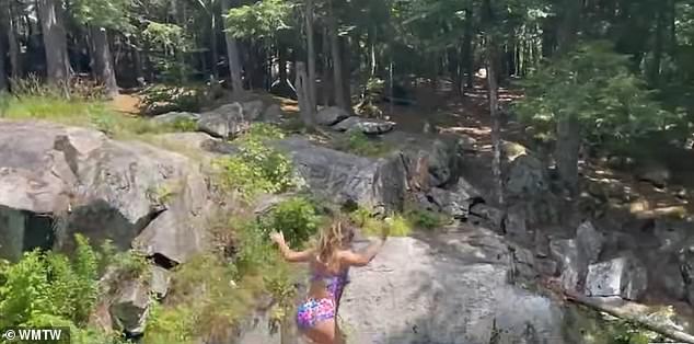 The rocks rise 30 feet above the Mousam River and are often the scene of daredevils making a splash