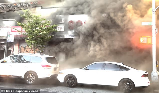 Video footage of the intense fire shows a thick plume of dark smoke billowing through the air as multiple fire engines arrive on the scene