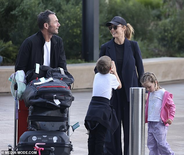 She looked as stylish as ever in a chic black blazer, paired with a matching T-shirt and baggy trousers