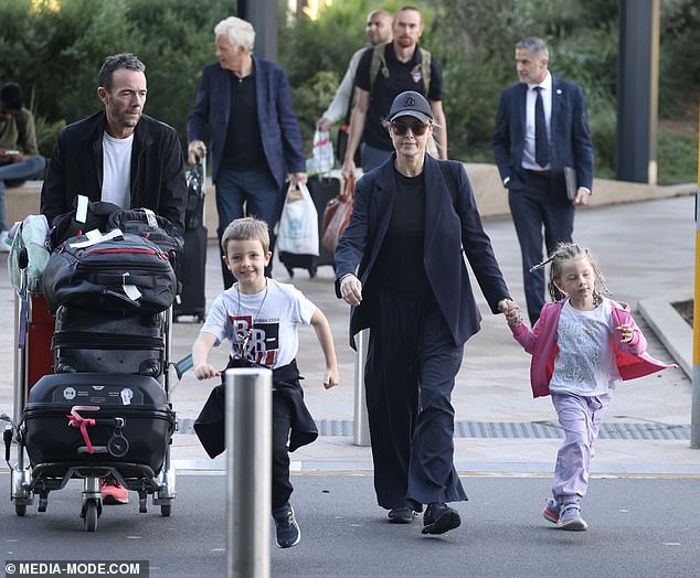 The Channel Nine star completed her look with black sneakers and accessories including a matching baseball cap, a gold chain and stylish sunglasses.