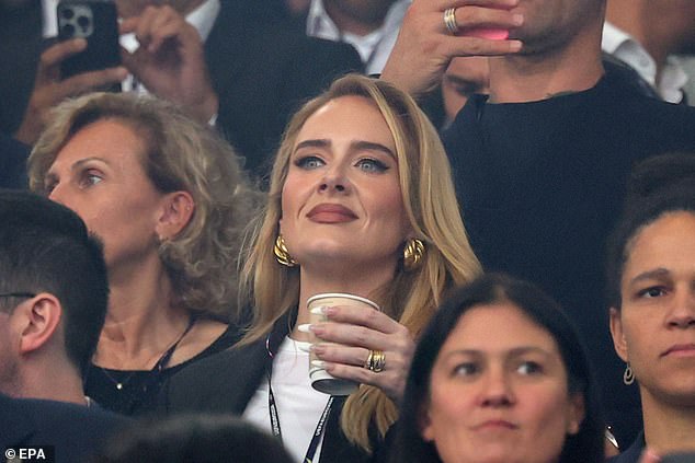 The 36-year-old singer flew to Dortmund in Germany to watch the team play the Netherlands in their epic 2-1 victory and was fully in the spirit of the match.