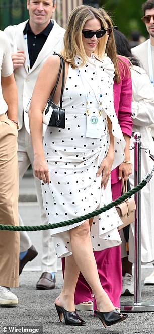 Margot's baby bump was visible under her one-shoulder halter dress