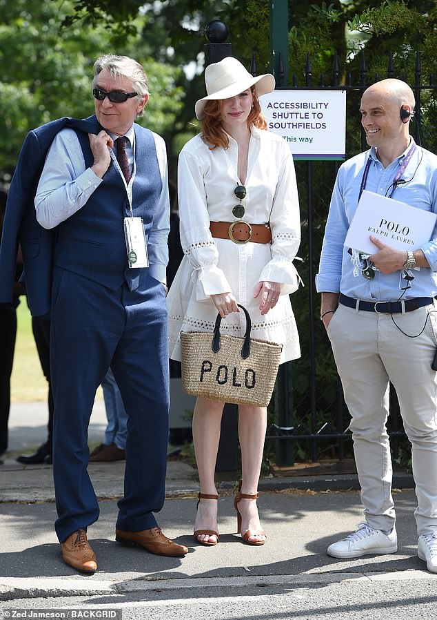 Eleanor Tomlinson looked effortlessly stylish in a white dress with a wicker bag