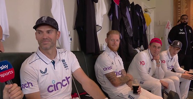 Anderson (left) sat alongside his England teammates who also enjoyed a celebratory beer