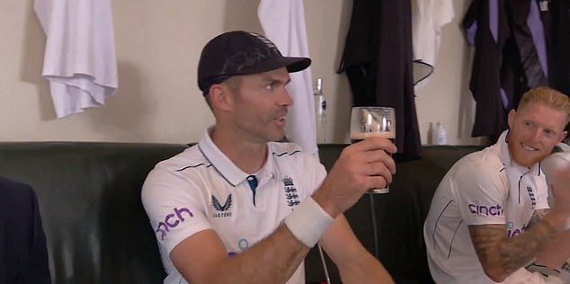 Anderson (center) cheered on his teammates before taking a sip of Guinness