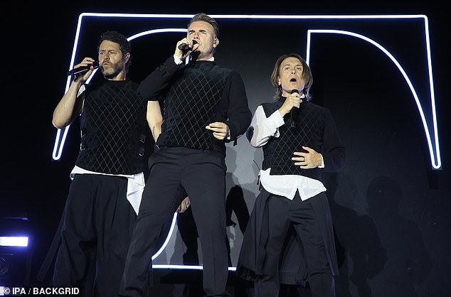 And while he was making his rare appearance, Take That took to the stage in Bologna, Italy, on Thursday night to give a smashing performance as part of their European 'This Life' tour (pictured left: Howard, Gary and Mark)