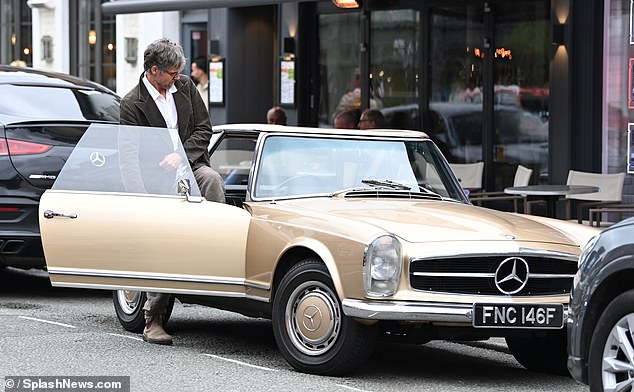 The star was also spotted in his classic gold Mercedes-Benz, wearing orange sunglasses