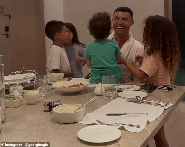 Cristiano Ronaldo, 29, looked in good spirits after Portugal's devastating loss at the European Championship (pictured: Cristiano with son Mateo and daughters Eva, Alana and Bella)