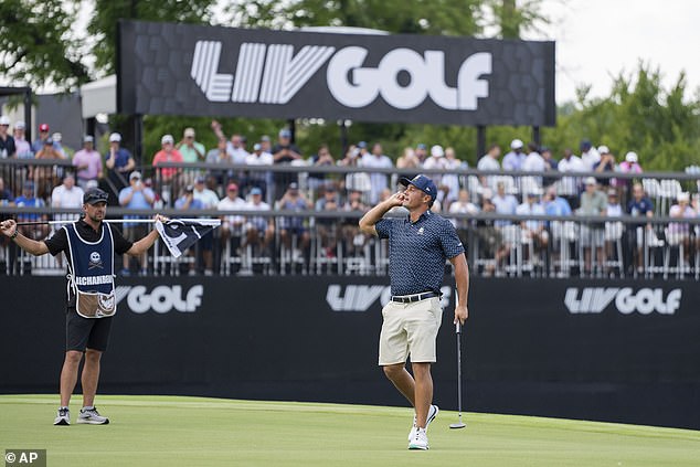 Crushers GC's DeChambeau reacts after his putt on the 15th green of a LIV event