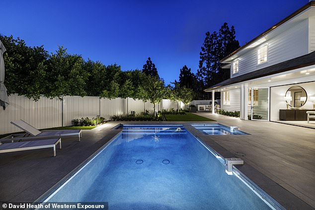 The four-bedroom, five-bathroom home spans 5,800 square feet and features a theater, game room and new backyard pool and spa