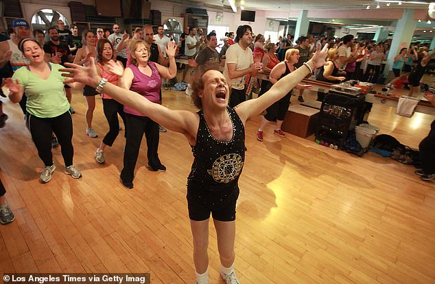 Simmons photographed teaching a fitness class in 2013