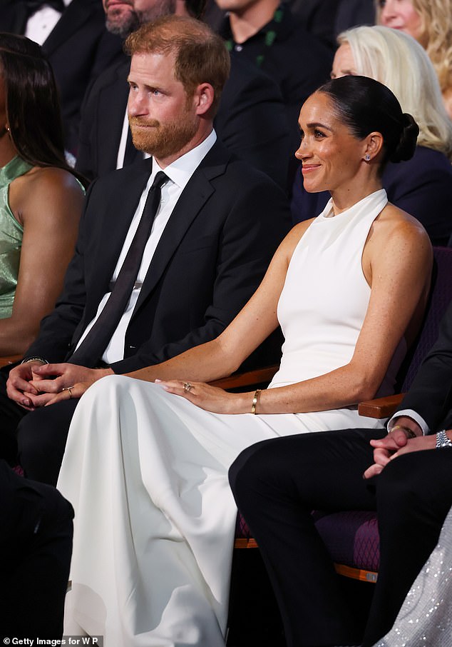 She held her husband's hand at the event, as he was considered for the prestigious Pat Tillman Award, wearing her £5,000 gold Cartier Love bracelet