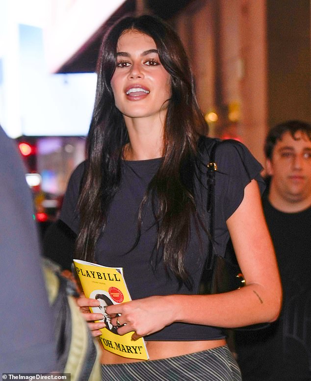 The 22-year-old Palm Royale star looked stylish in a cropped black top with flutter sleeves