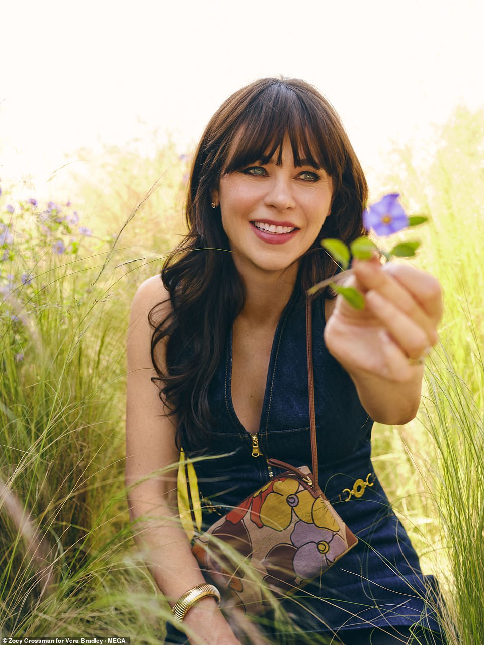 The actress presented a lavender flower to the camera in one shot. 