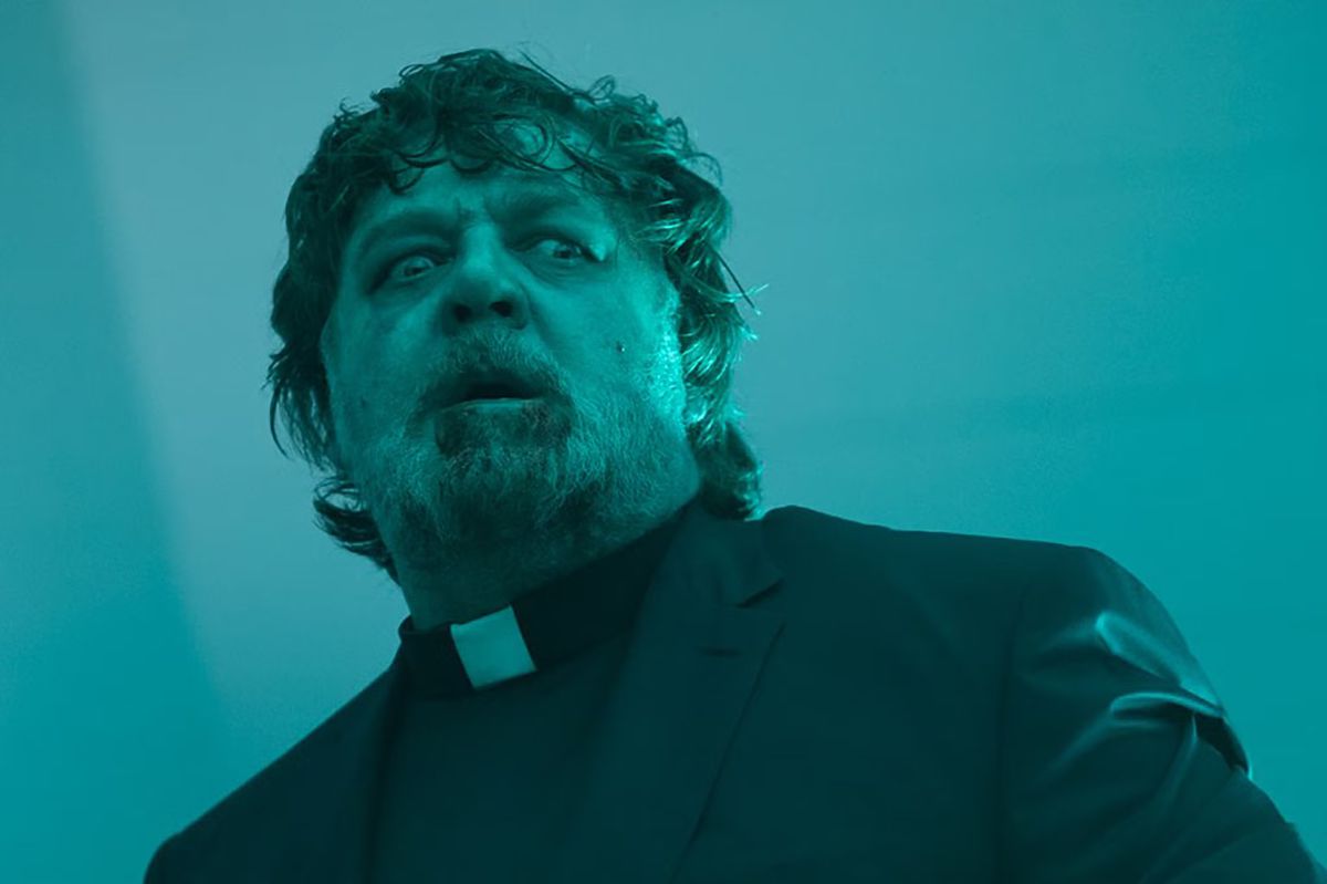 Russell Crowe dressed as a priest with dried bile and blood all over his beard in The Exorcism.