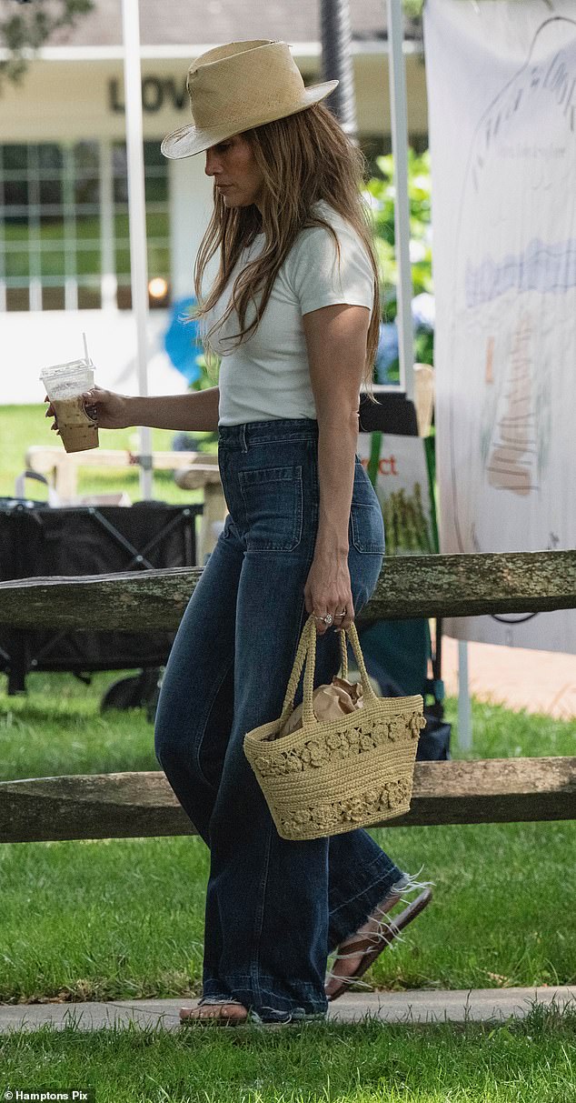 For their cruise around the Hamptons, Lopez kept it casual-cool in baggy blue jeans and a white cropped T-shirt