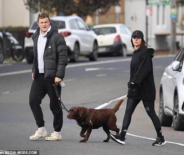 Liam meanwhile wore a lilac hoodie with black sweatpants and Crocs with socks on his feet