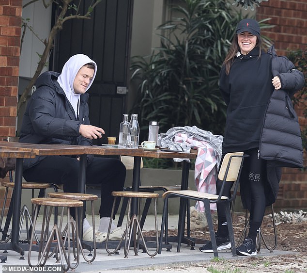 Mason grinned broadly as he walked with the Alice Springs-born athlete, with both members of the pair wearing heavy winter coats