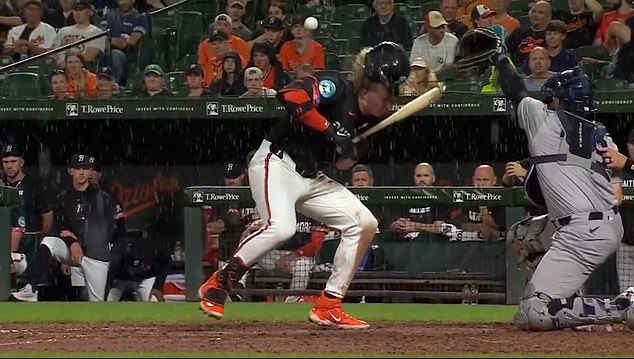 Kjerstad and the Orioles dugout react after his at-bat against the Yankees in rainy Baltimore