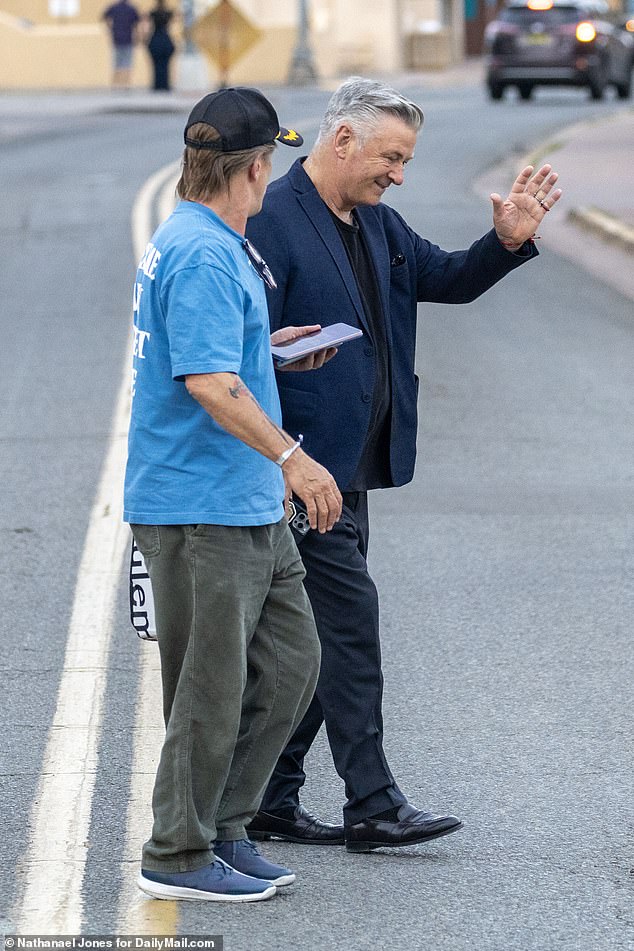 Alec was met with cheers from fans as he and a group walked towards the restaurant, and he was seen waving and giving a thumbs up to his supporters