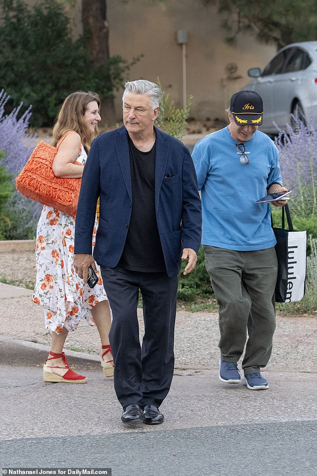 Alec's brother Stephen kept it casual in a blue T-shirt and gray pants with a Lululemon bag in tow