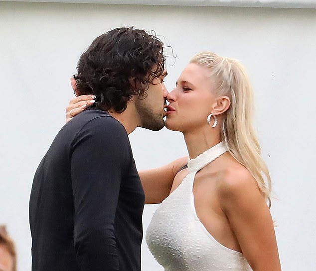 Graziano Di Prima kisses his wife Giada Lini, an Italian dancer