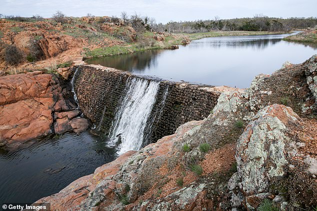 The average Oklahoma family's annual homeownership costs are 14.8 percent lower than the national average, according to GOBankingRate. Pictured: Wichita Mountains Wildlife Refuge waterfall