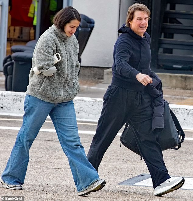 The Mission Impossible star looked demure in a black hoodie and jacket, while carrying a large matching backpack