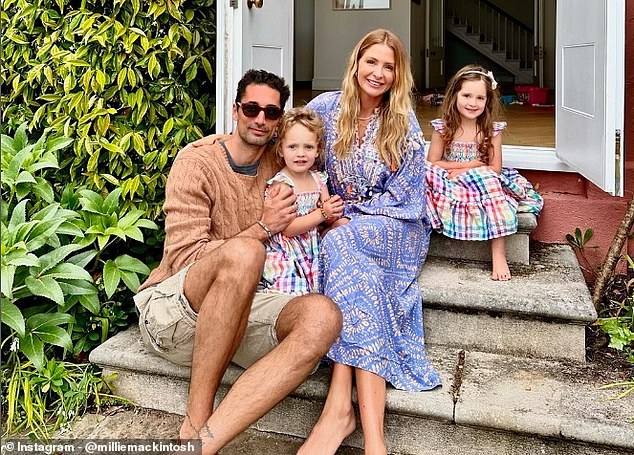 The family took a group photo for Instagram on the steps of their home for the weekend, with Aurelia standing between her parents and Sienna sitting behind her