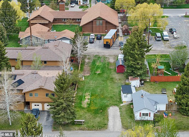 With access to both a street and an alley, an owner with a good budget could build a three-story building with an apartment on each floor and parking in the back