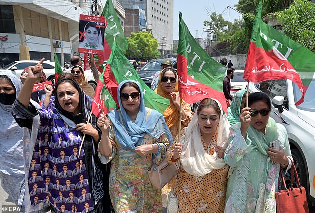 Supporters of former Prime Minister Imran Khan, founder of the opposition Pakistan Tehreek-e-Insaf (PTI), celebrate after a court overturned Khan's conviction for an illegal marriage