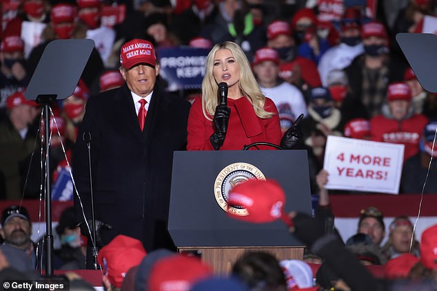 President Donald Trump listens as his daughter Ivanka Trump speaks during a campaign rally at the Kenosha Regional Airport on November 2, 2020 in Kenosha, Wisconsin