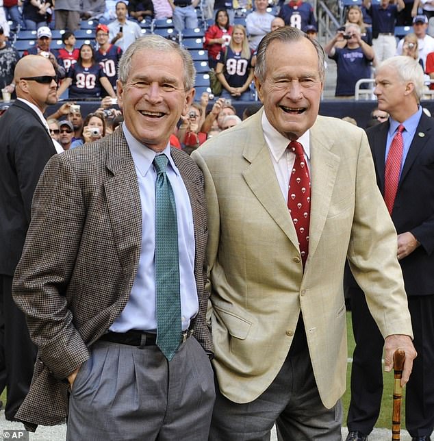 A Kentucky newspaper article linked Bush's ancestry to enslaved members of the Thomas family, Holman's ancestors. Former Presidents George H. W. Bush, right, and George W. Bush, left, are pictured together in 2009